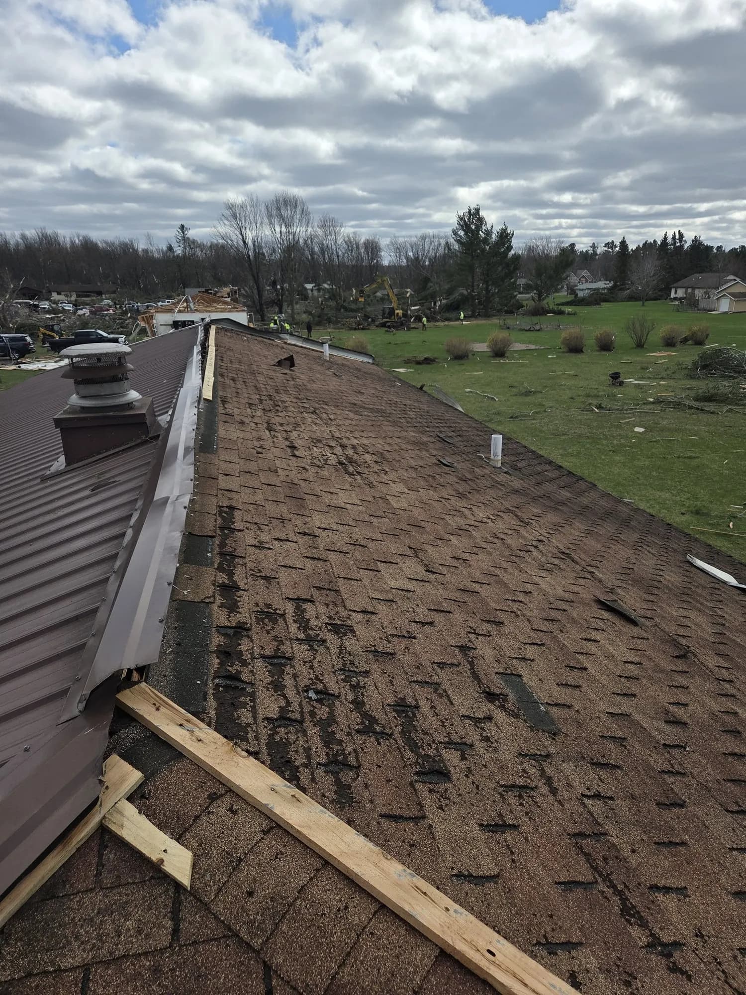 Partial reroof in progress over a residential pitched roof.